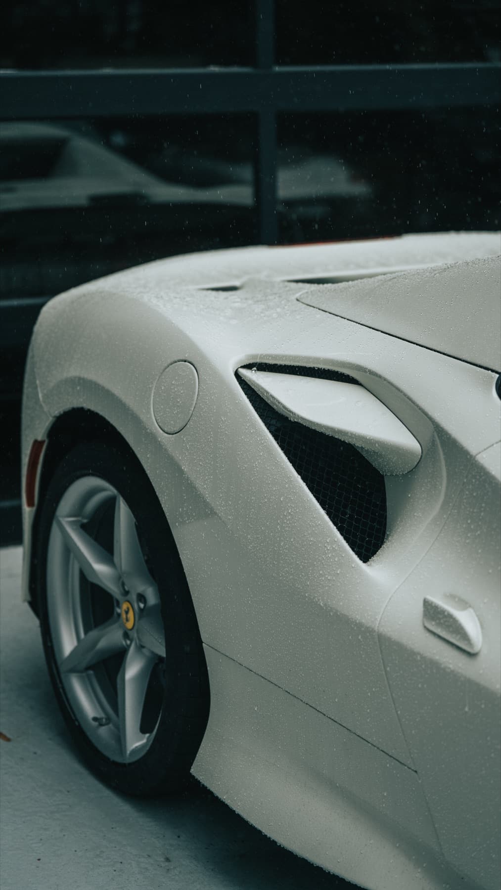 Close-up of a white Ferrari's front end