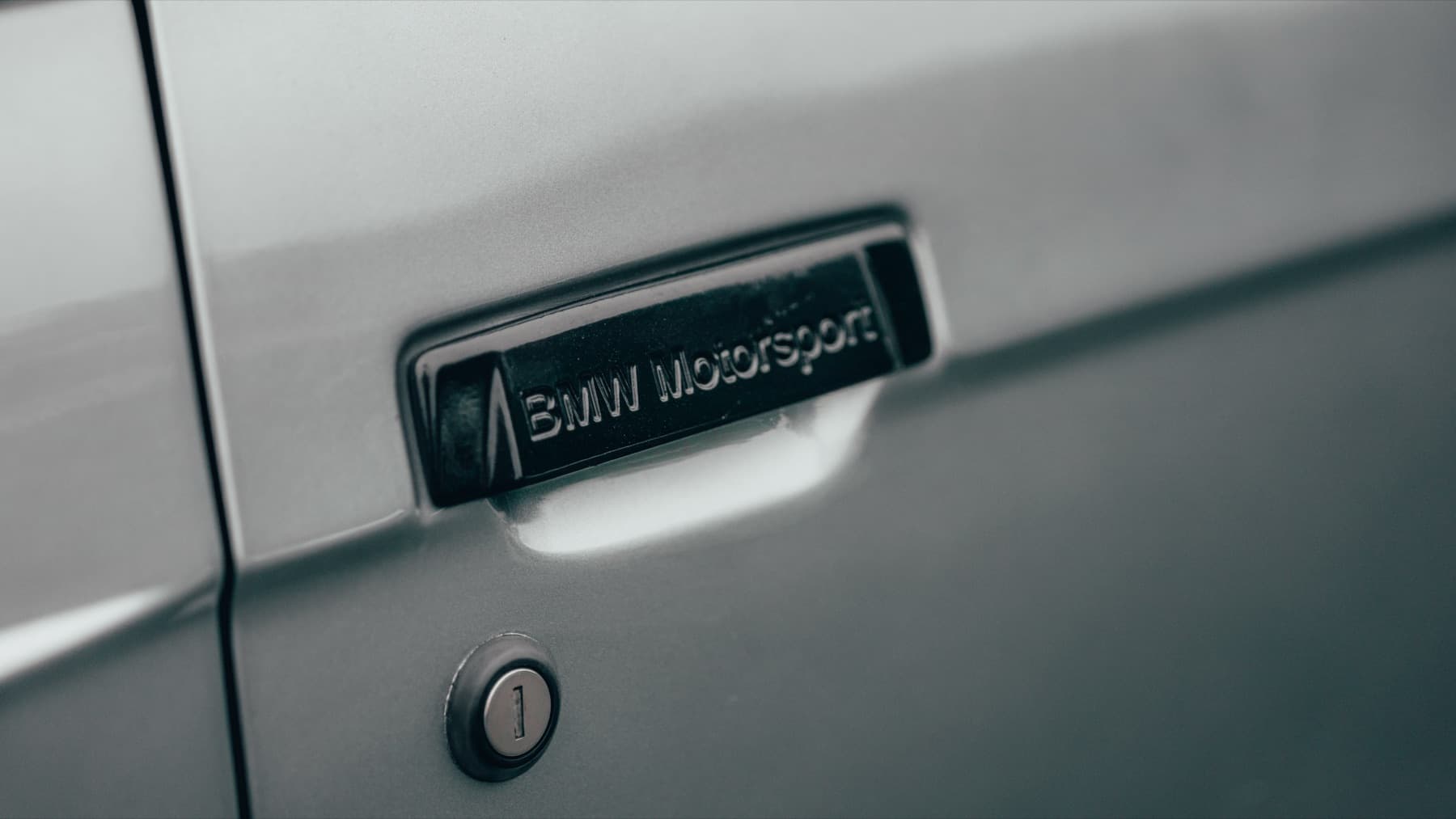 Badge detail on a silver BMW E30 M3