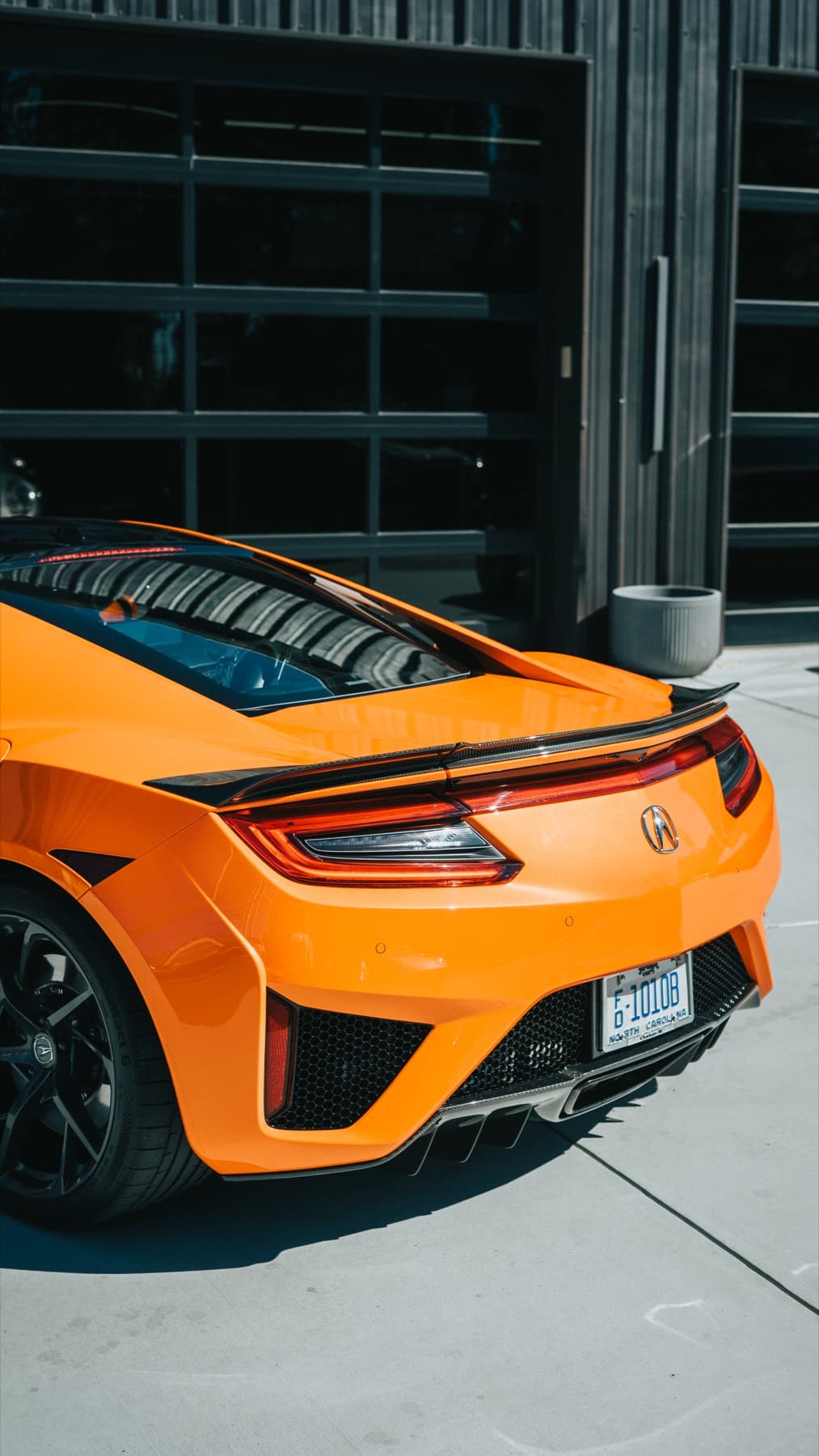 Front of an orange Acura NSX