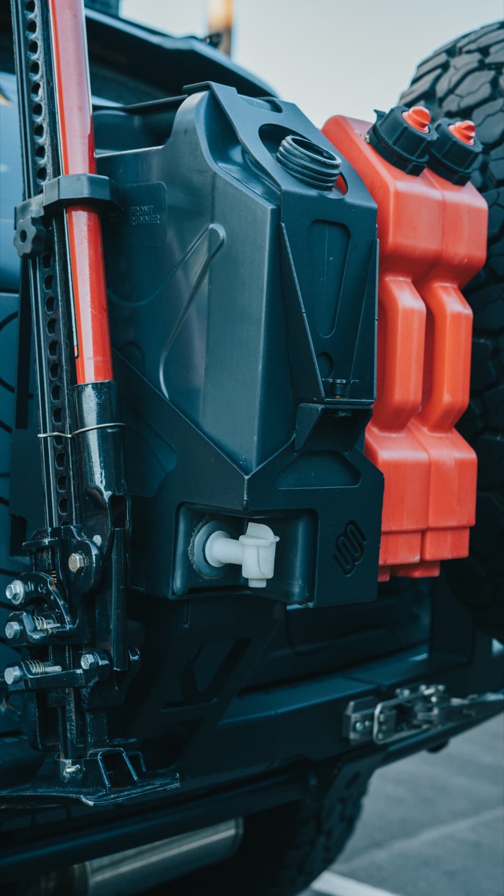 Rear-mounted spare tire carrier on an off-road build