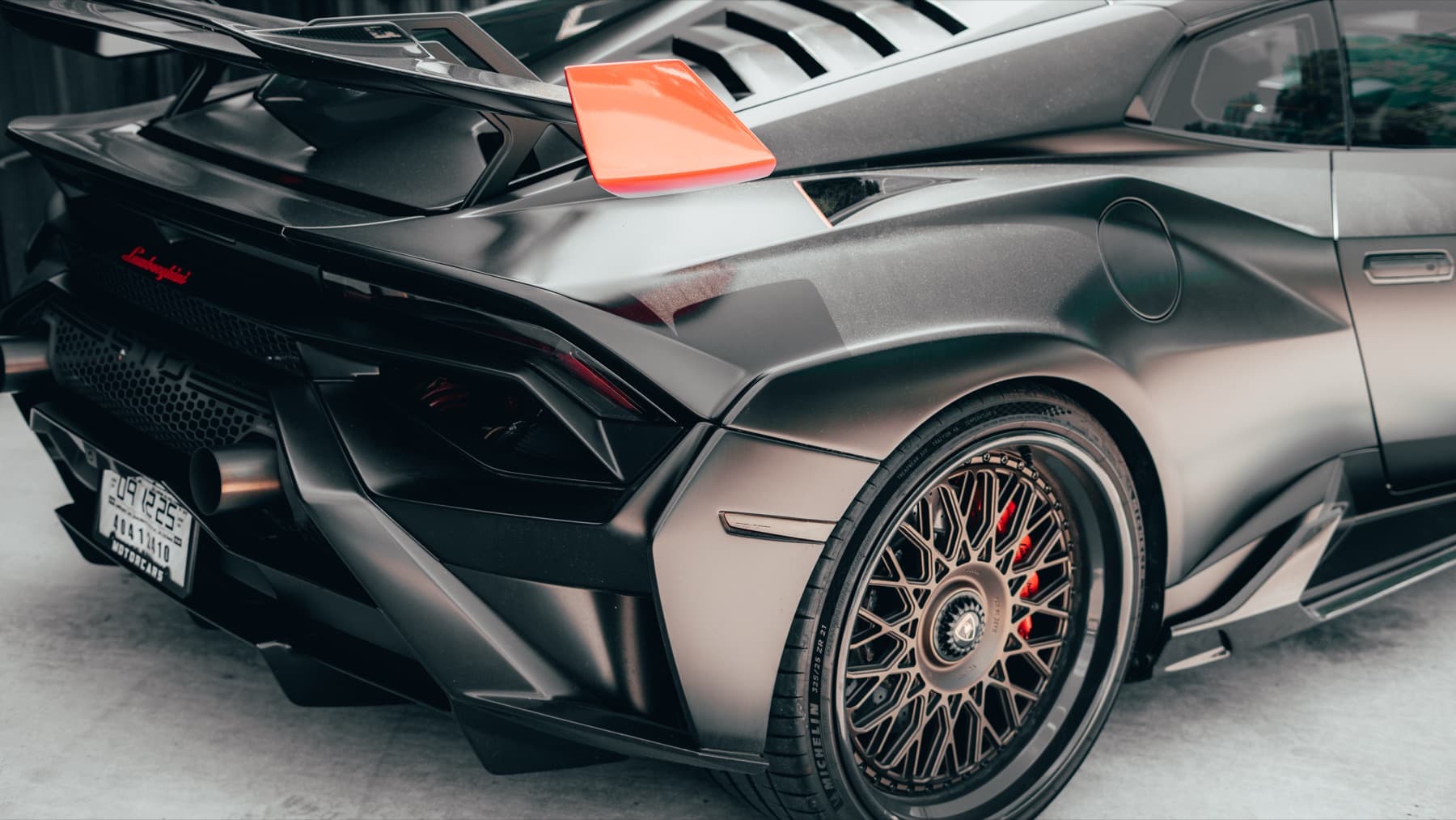 Rear of a grey Lamborghini Huracán STO