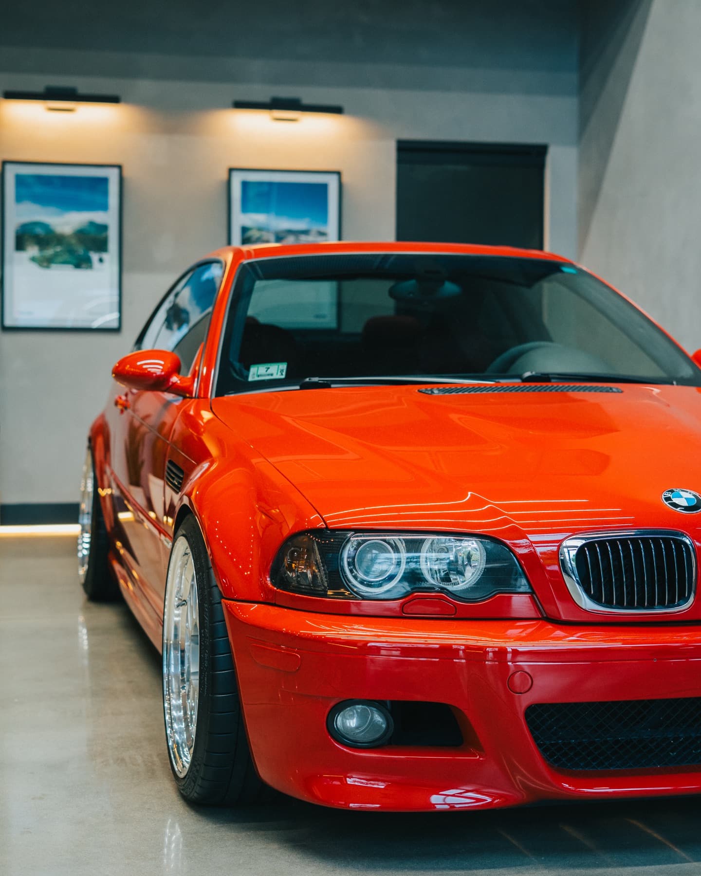 Orange BMW M3 E46 outside the shop
