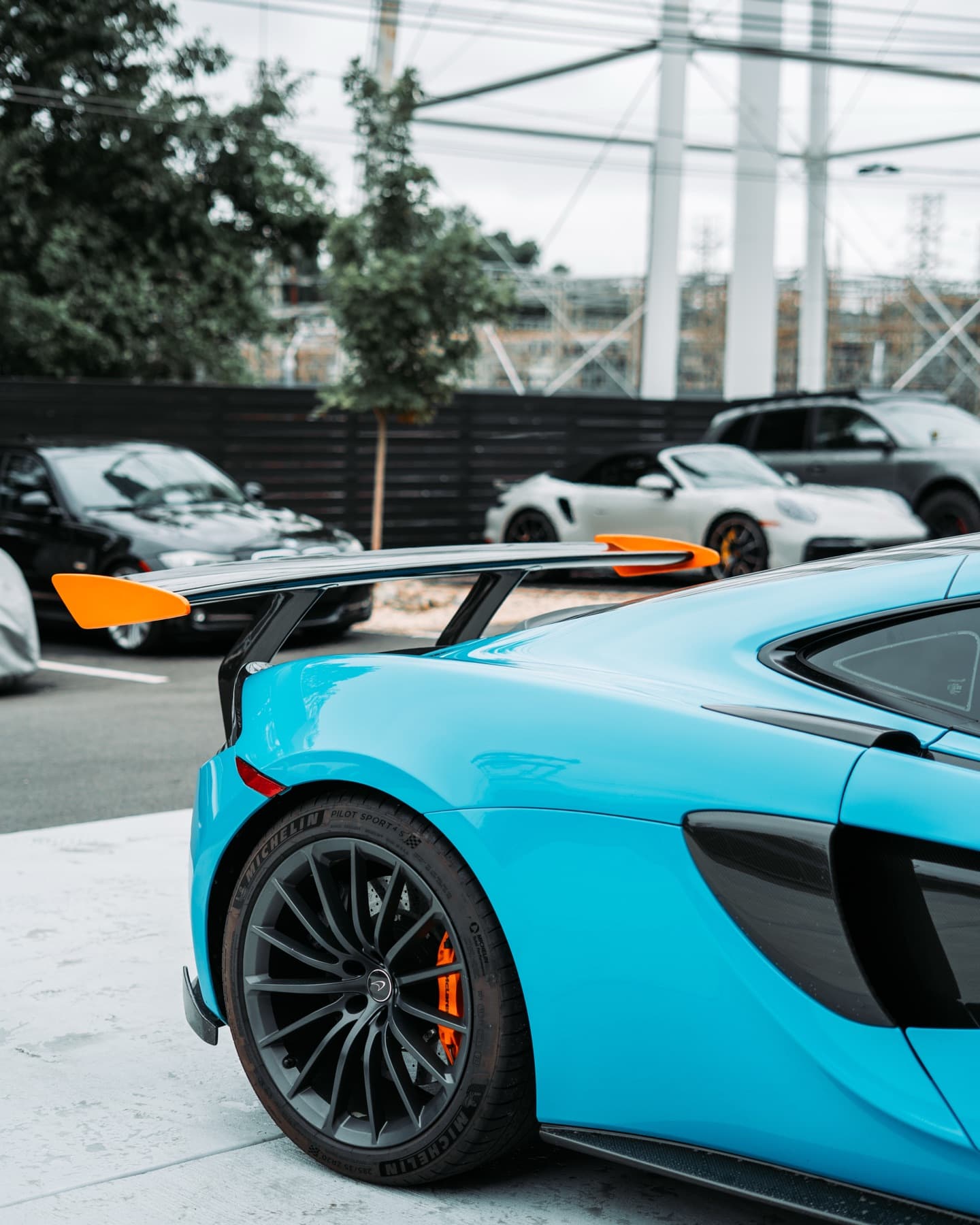 Light blue McLaren outside the shop