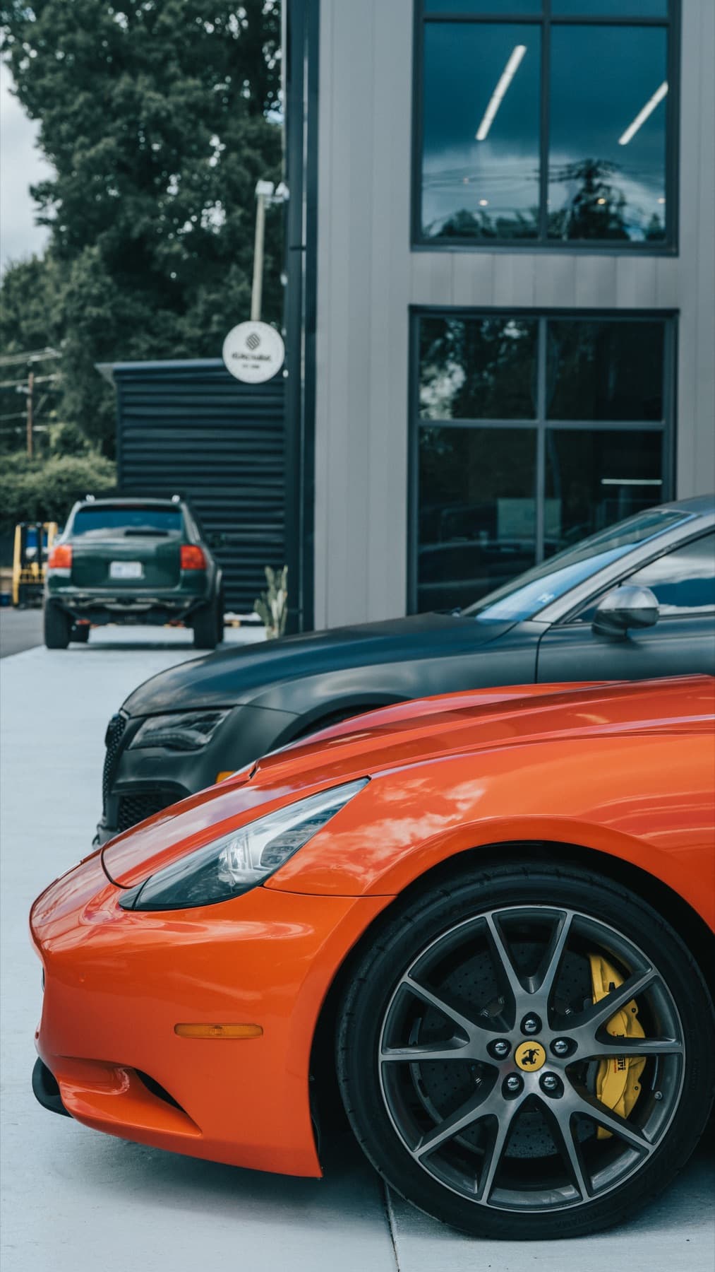 Orange Porsche GT3 outside the shop