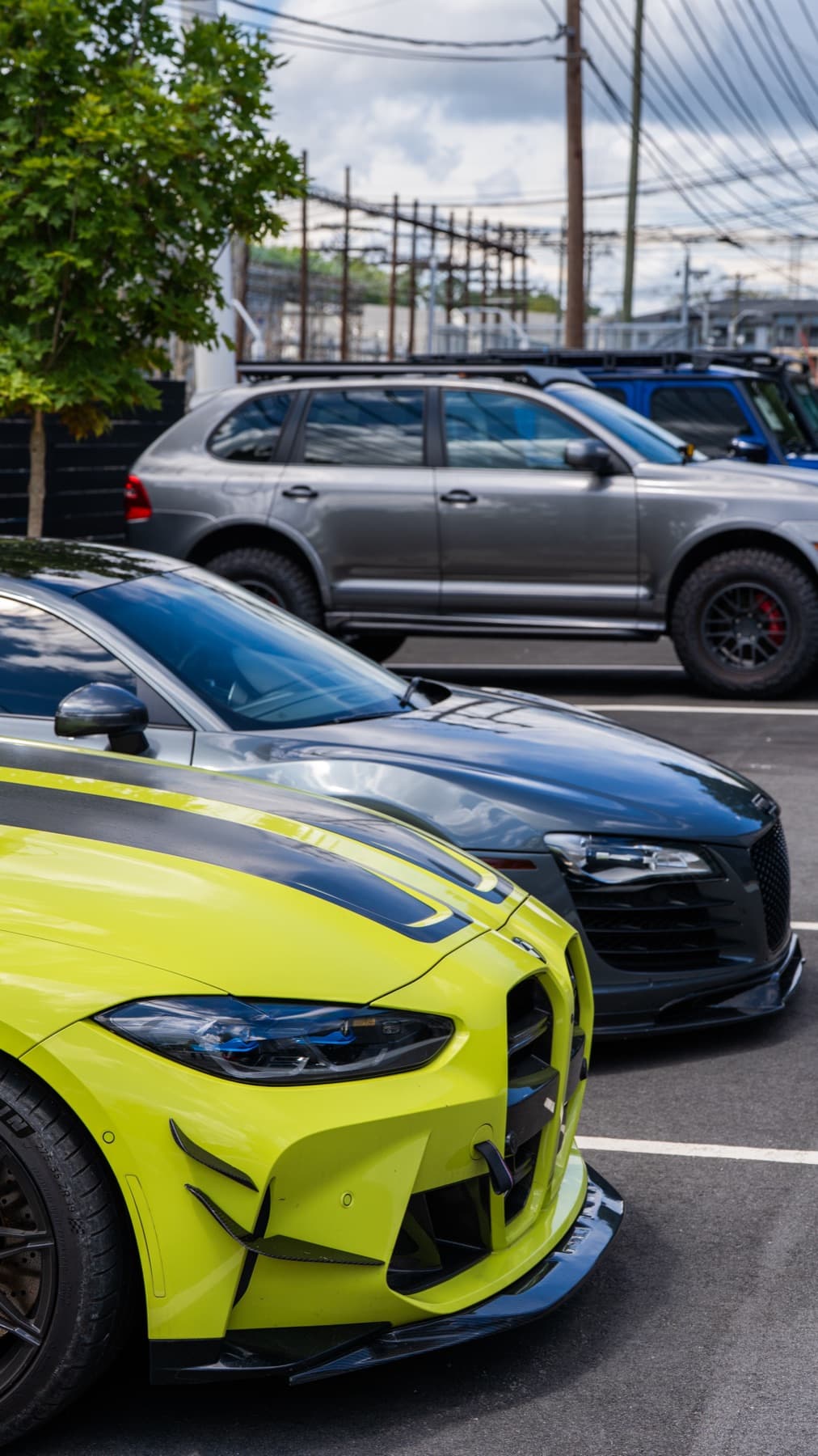 Orange, yellow and blue sports cars lined up