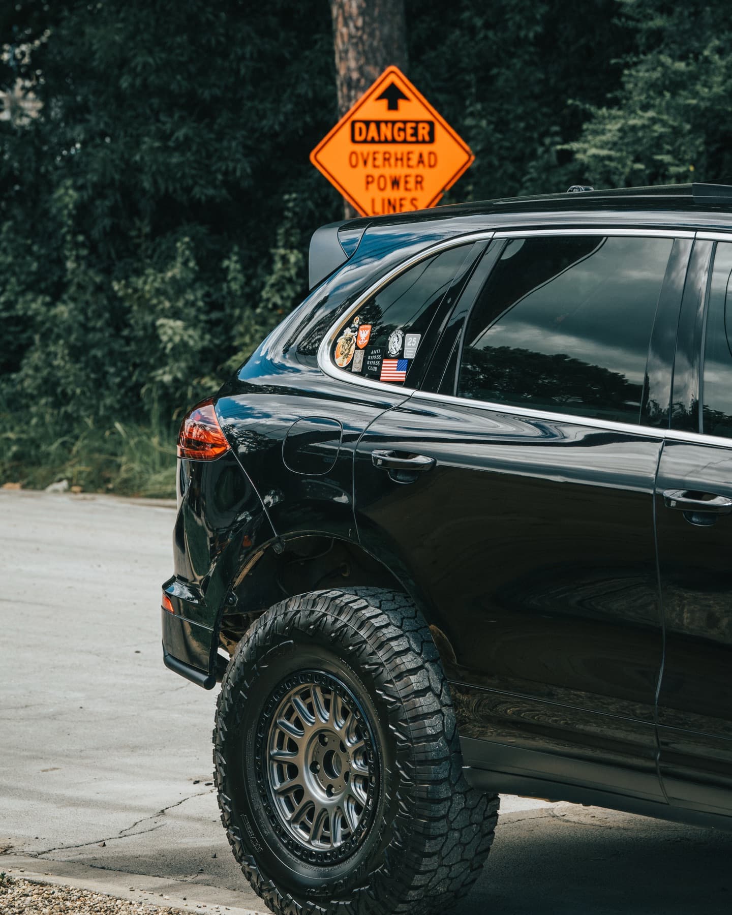 Black Porsche Cayenne off-road build in profile