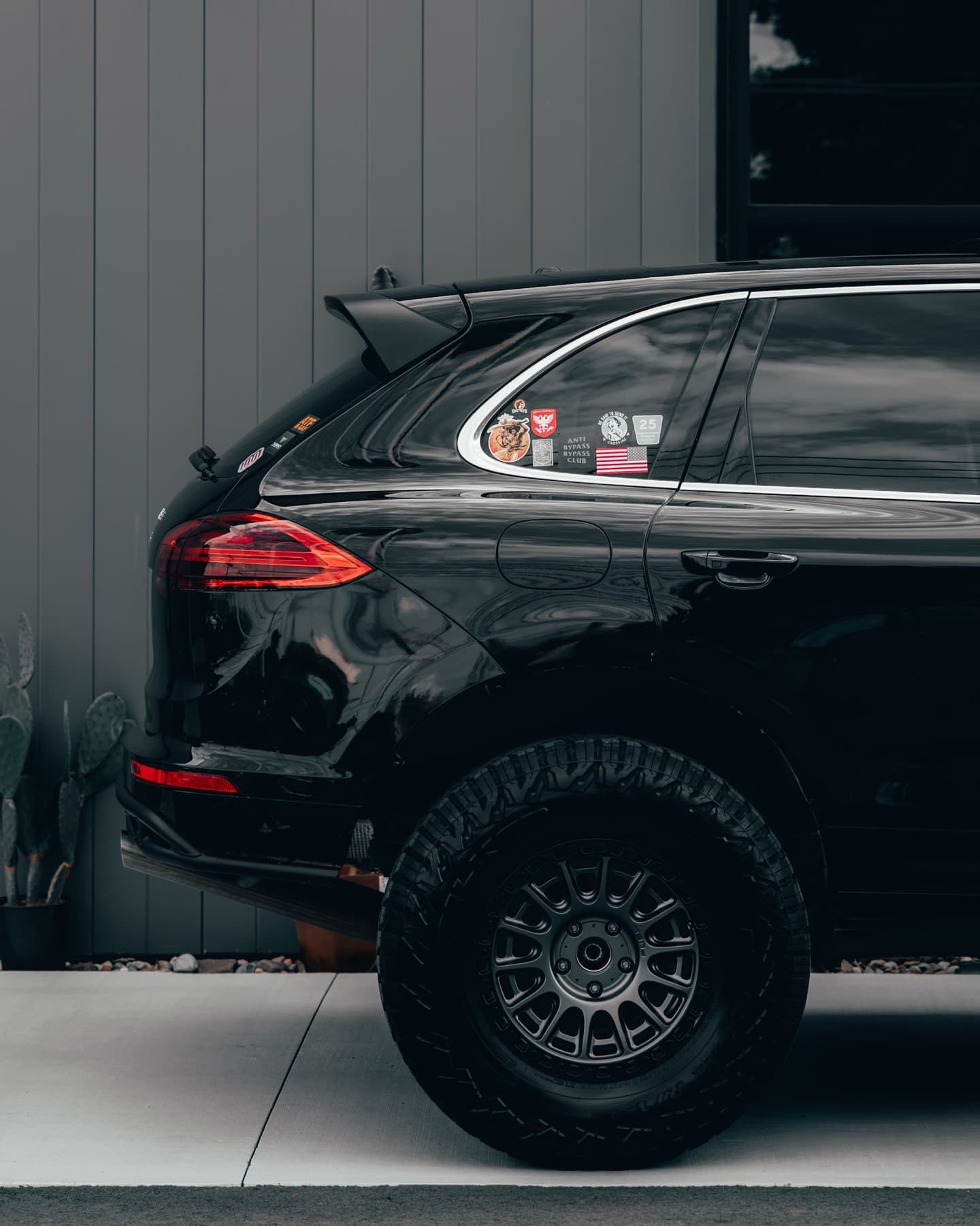 Black Porsche Cayenne off-road build in profile