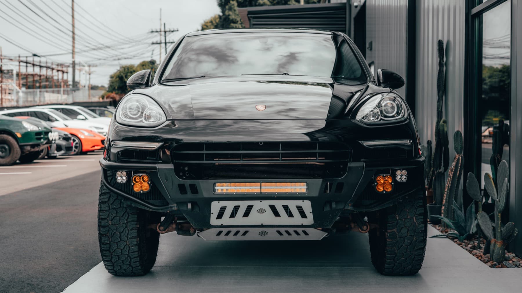 Front of a black Porsche Cayenne off-road build