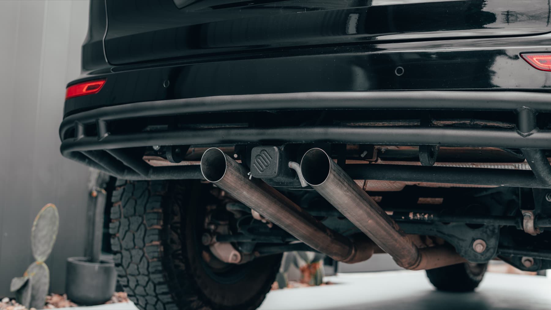Exhaust detail under a Porsche Cayenne