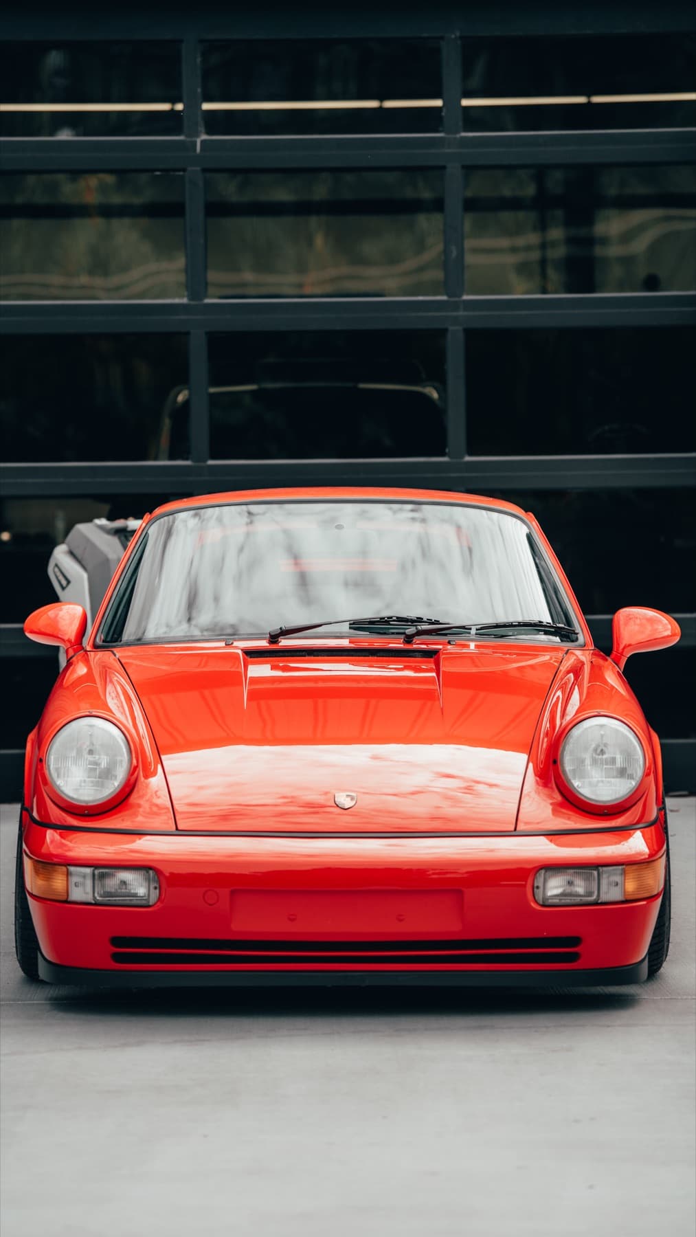 Front of an orange Porsche 911