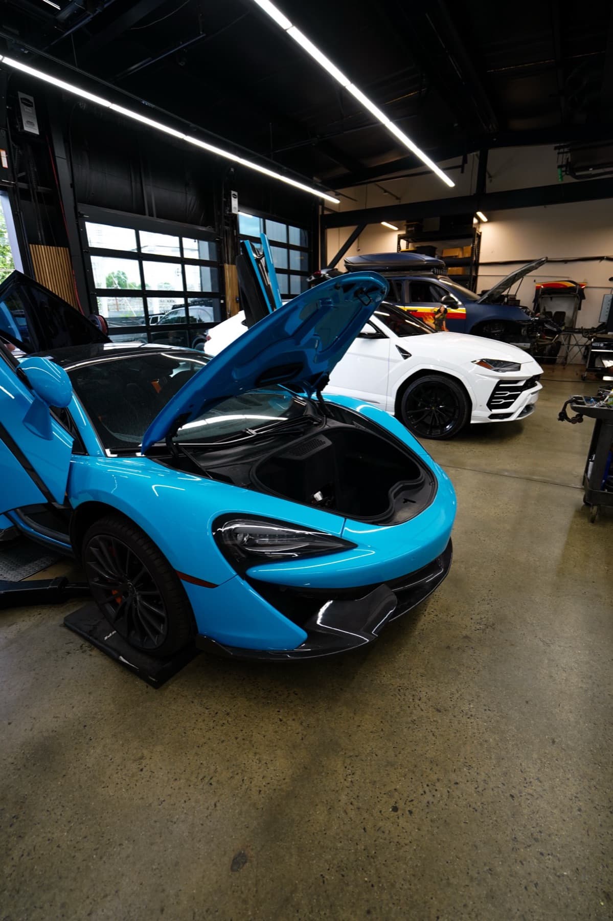 Light blue McLaren with its doors open