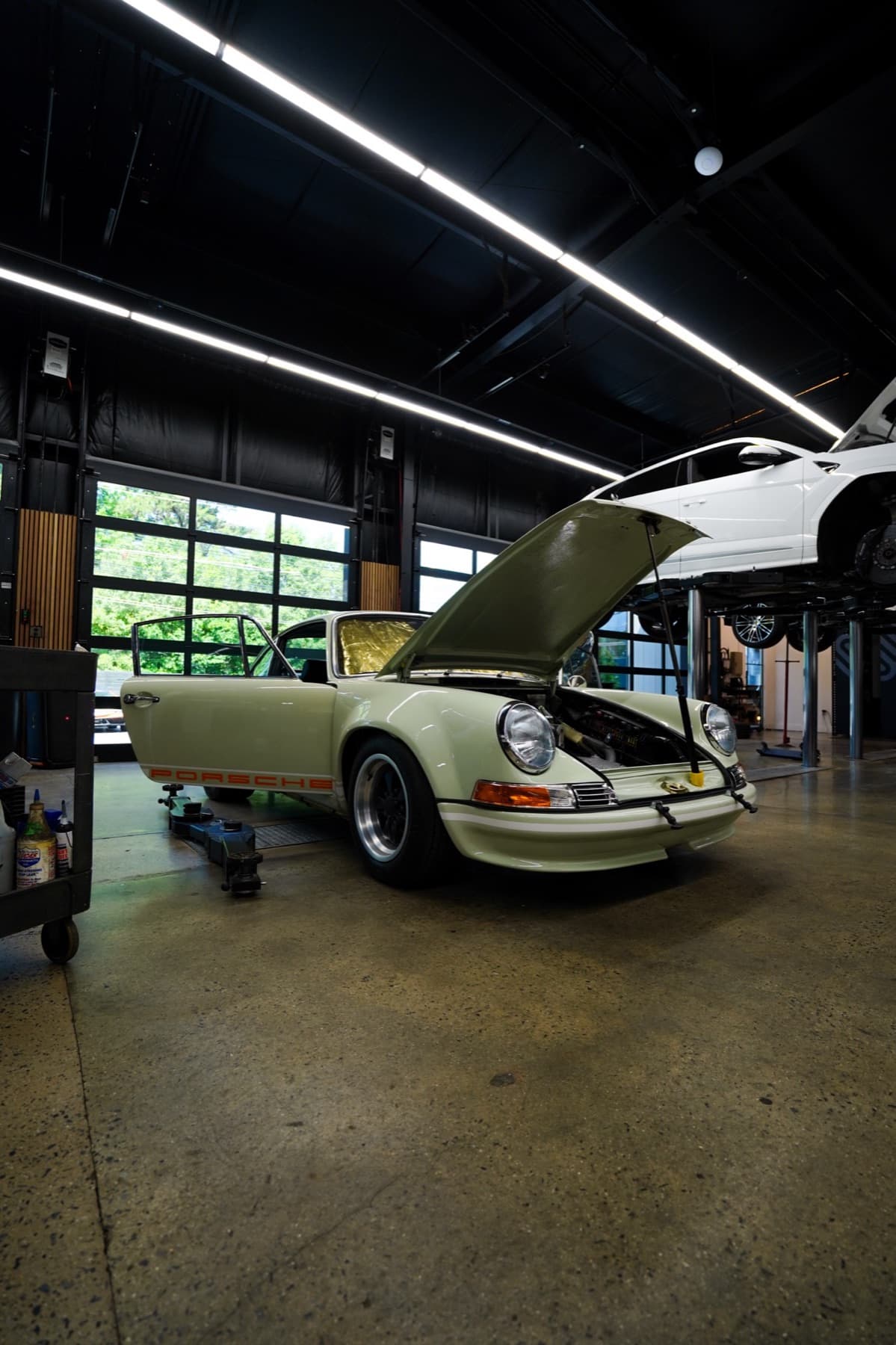 Classic white Porsche 911 with its engine lid open