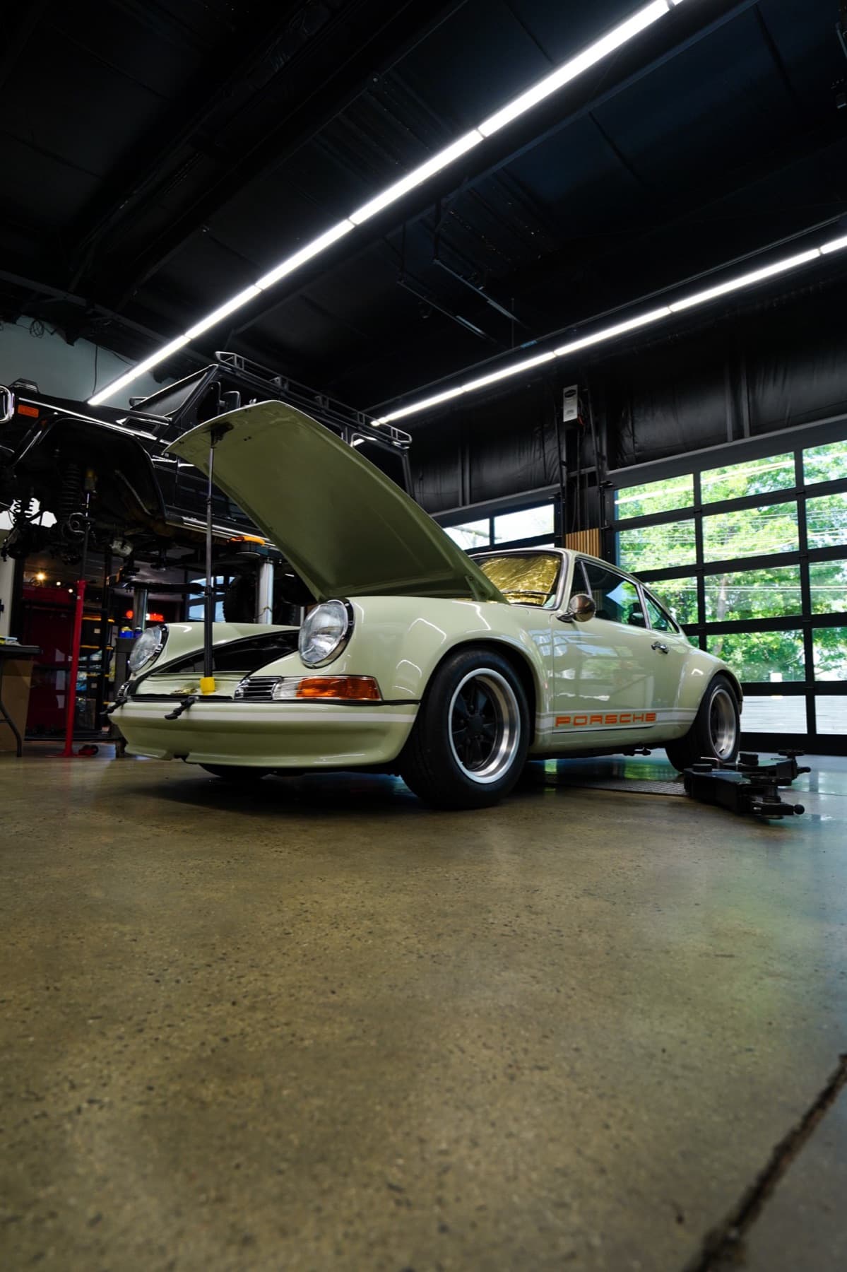 Classic white Porsche 911 in the service bay