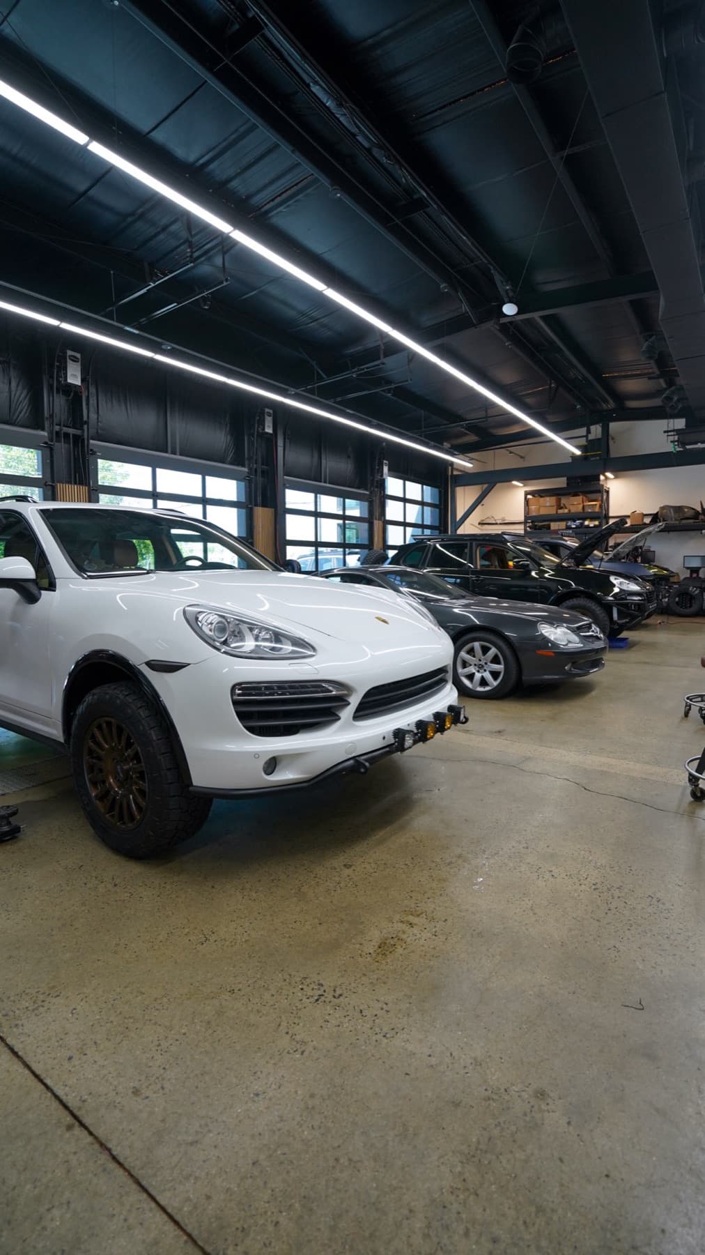 White Porsche Cayenne in the shop