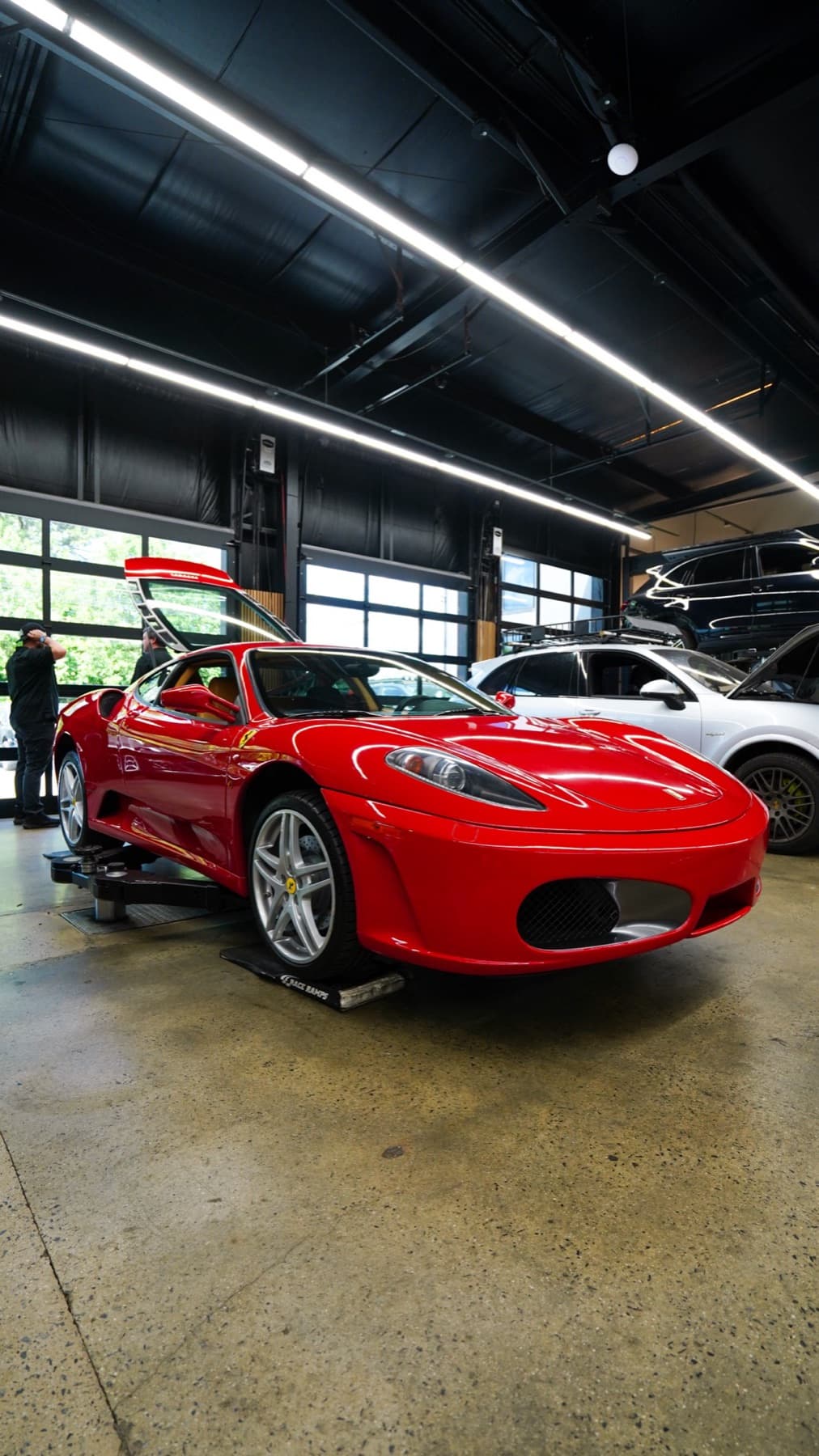 Red Ferrari in the service bay