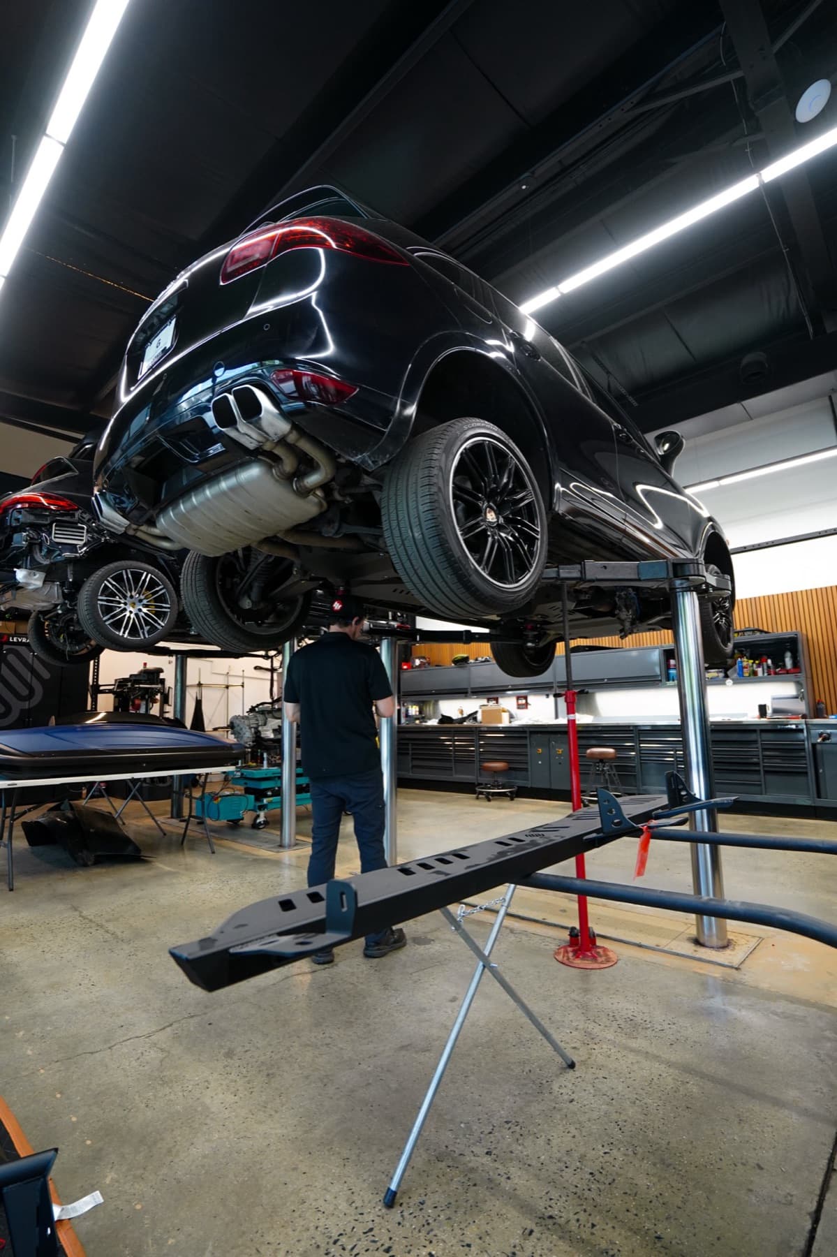 Black SUV raised on a lift