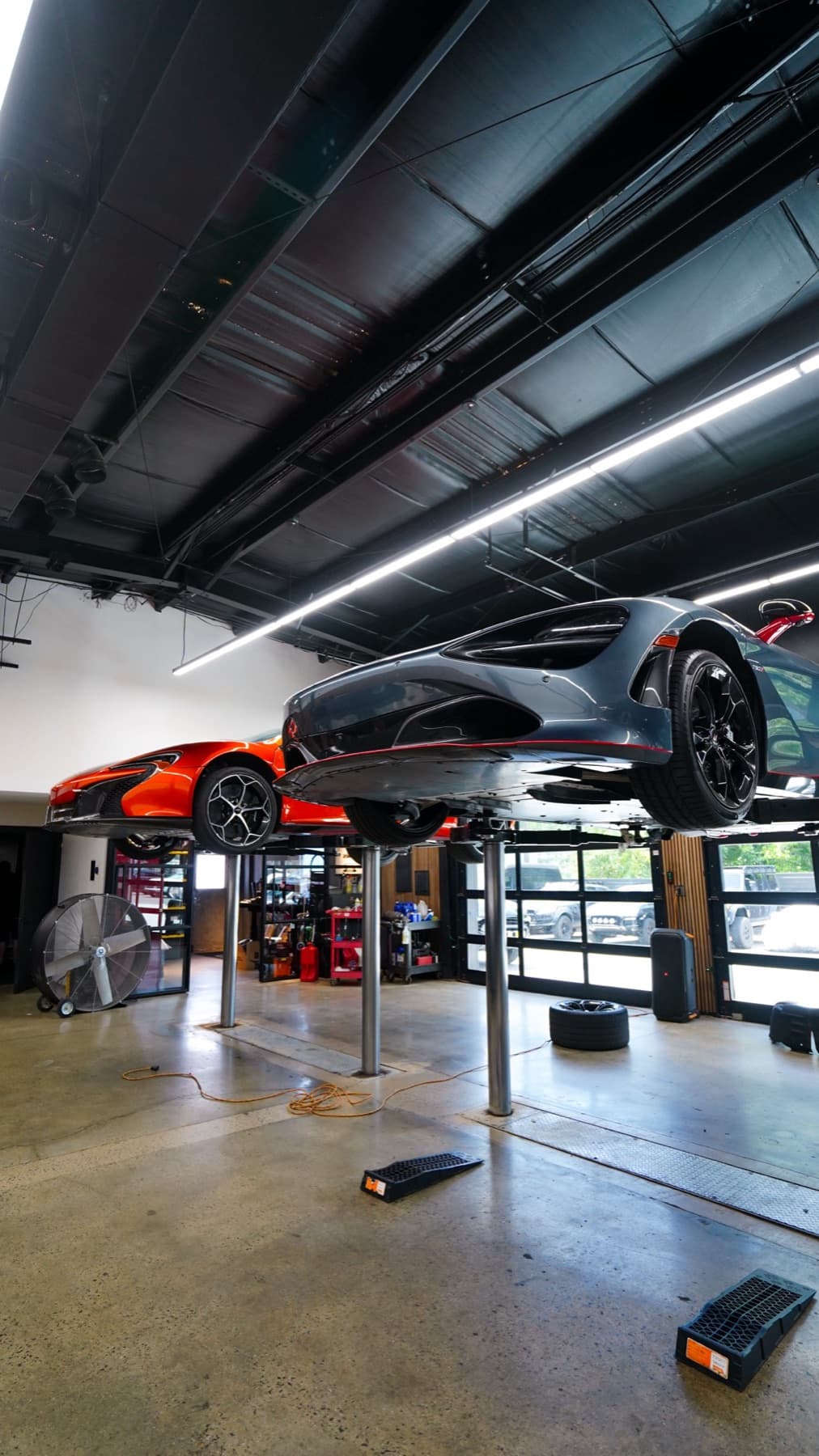 Dark car raised on a lift