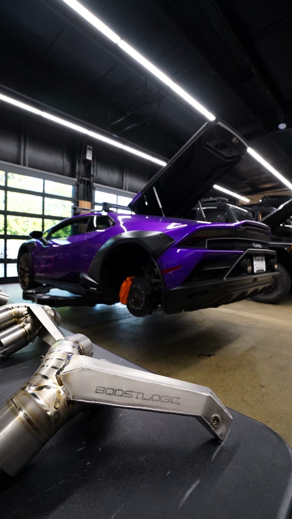 Purple sports car with its engine cover open
