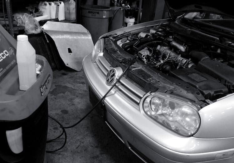 Air conditioning compressor service in progress