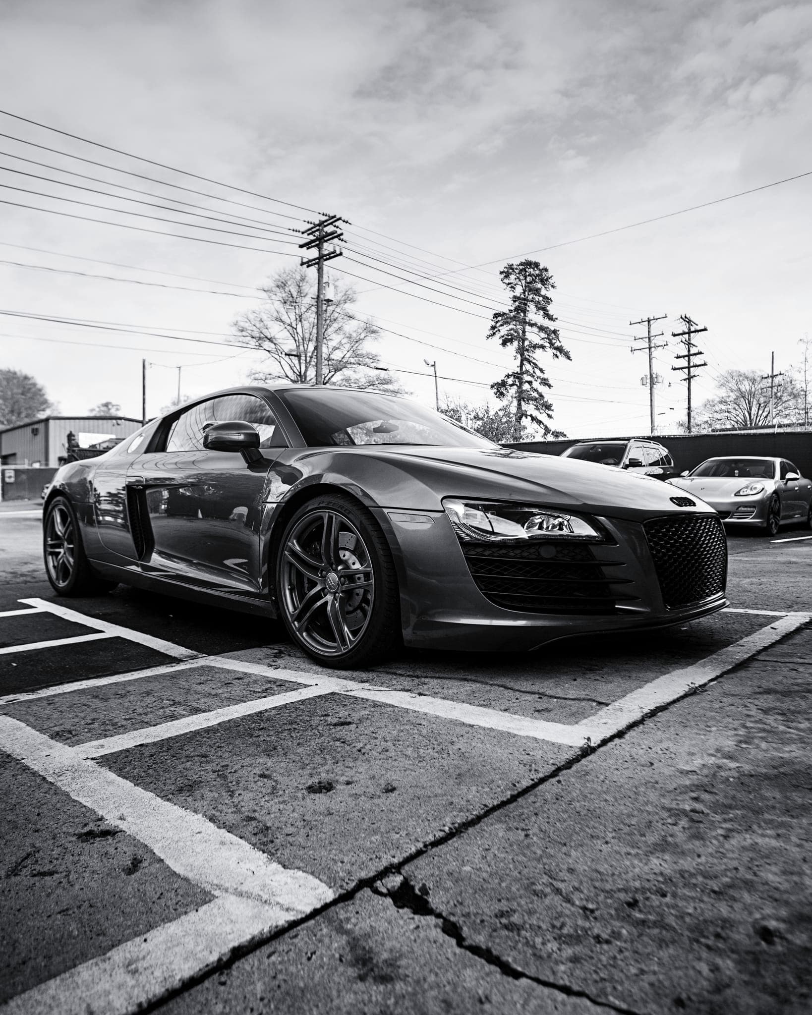 Technician running factory diagnostic equipment on an Audi R8