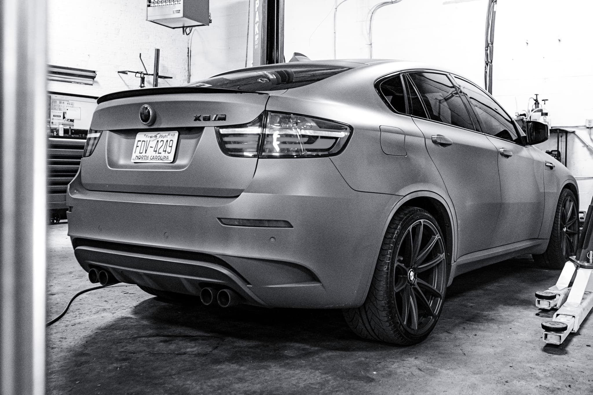 Olive Drab Green BMW X6M in for leak repair